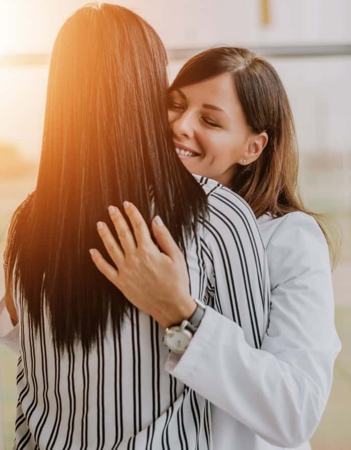 woman hugging egg donor