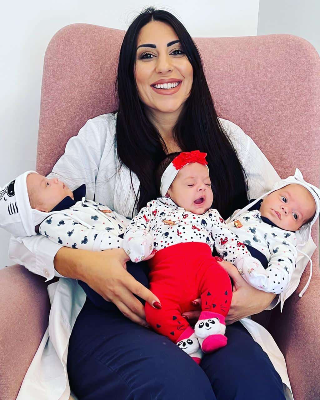 Dr. Monica Efstathiou with babies at Embryon Fertility Center in Cyprus